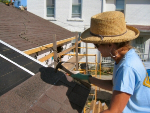 Woman Habitat Volunteer Shingling Woman Habitat Volunteer Shingling