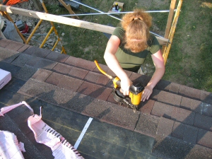 Caroline starts installing shingles